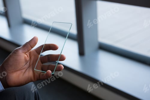 Preview: Male executive using mobile phone