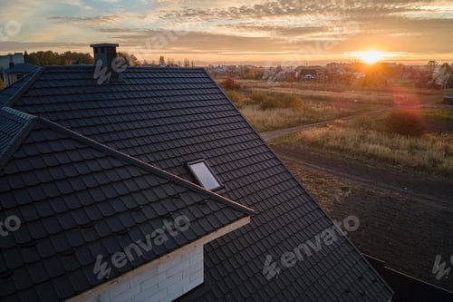 Preview: Closeup of house roof top covered with ceramic shingles. Tiled covering of building