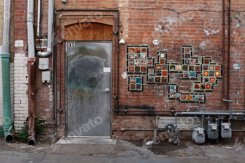 Preview: Exterior of a building with a bevy of framed artwork of various sizes and styles adorning the walls