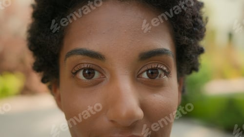 Preview: Extreme close up female face cropped African American ethnic girl woman young healthy lady close-up