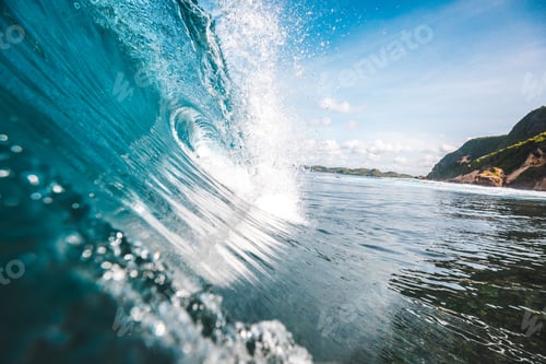 Preview: Magnificent view of a wave with rocksnin the background captured in Lombok, Indonesia
