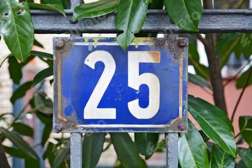 Preview: Closeup shot of the number twenty five sign on a blue background