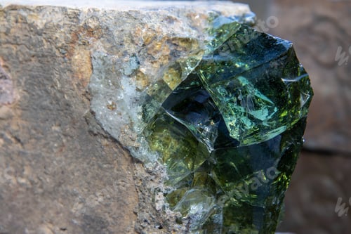 Preview: A Solid Brick Enclosing Green Glass
