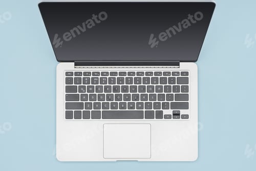 Preview: Top view of laptop with blank screen isolated on light blue