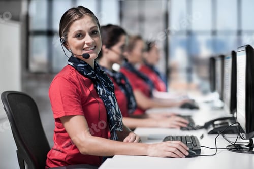 Preview: Portrait of female telephonists at work in call centre
