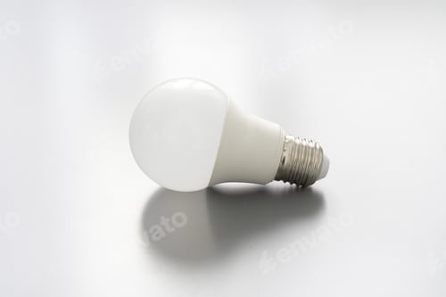 Preview: Light bulb on gray background close up