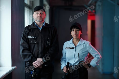 Preview: Two guards in corridor of building