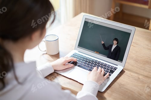 Preview: Woman Learning Online with Teacher on Screen