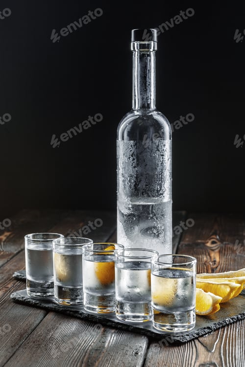 Preview: Vodka in shot glasses on rustic wood background