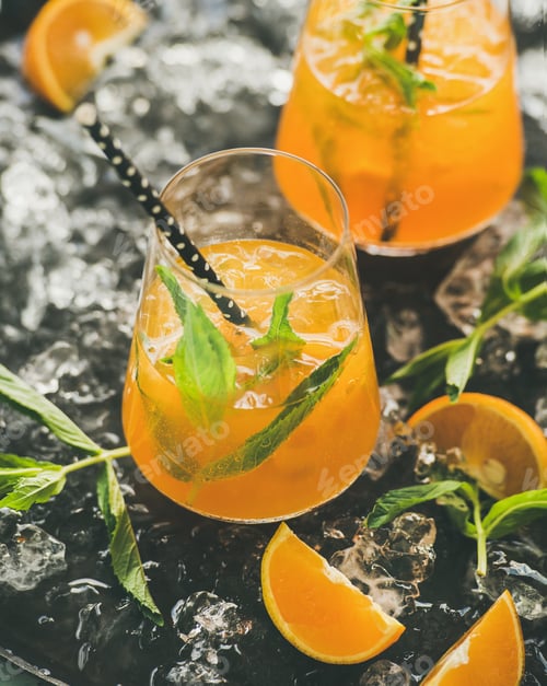 Preview: Refreshing cold alcoholic summer cocktail in glasses over dark background