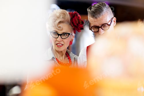 Preview: Quirky vintage couple browsing in antiques emporium