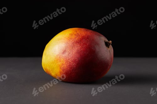Preview: fresh raw of mango on black background