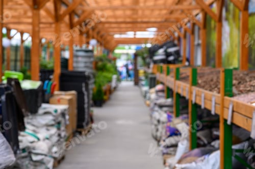 Preview: Shop of garden equipment. Lawn mowers. Defocused image.