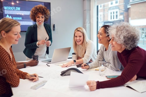 Preview: Pregnant Businesswoman Leads Creative Meeting Of Women Collaborating Around Table In Modern Office