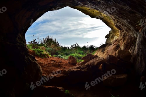 Preview: The entrance or exit of a cave formed in limestone in a Maltese valley - Ghar il-Buz, Malta