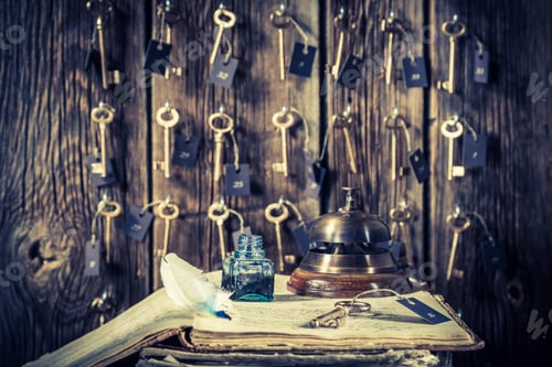 Preview: Vintage front desk in hotel with keys for rooms and guestbook