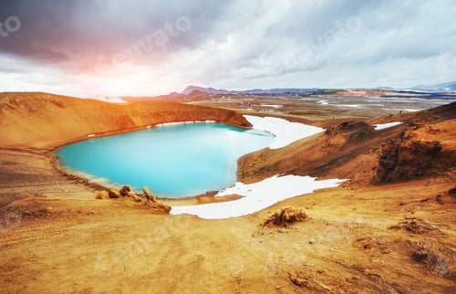 Preview: Giant volcano overlooks. Turquoise provides a warm geothermal wa