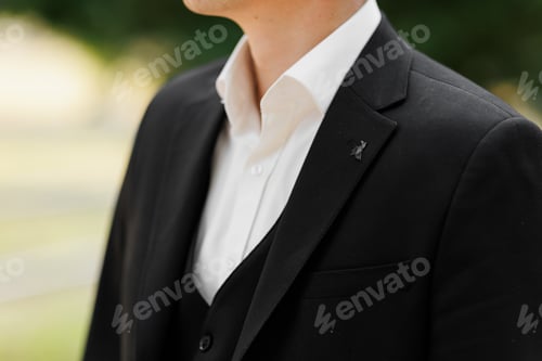 Preview: Cropped front view shot of man wearing white shirt with up unbuttoned button, waistcoat and classi