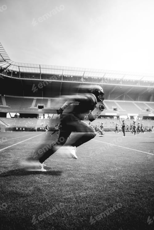 Preview: American football player sprinting in motion.