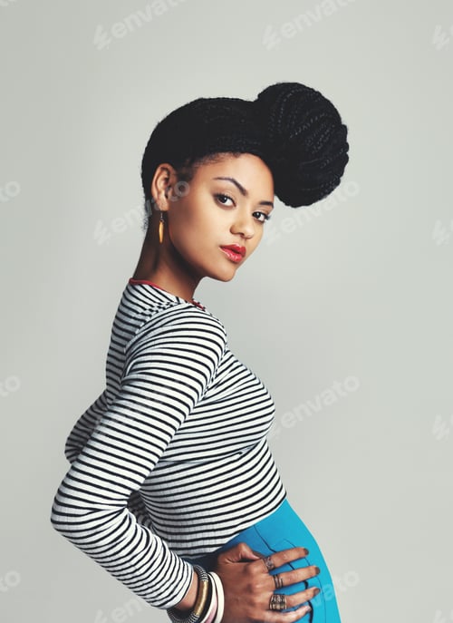 Preview: Youve got style. Studio shot of a fashionable young woman posing against a grey background.