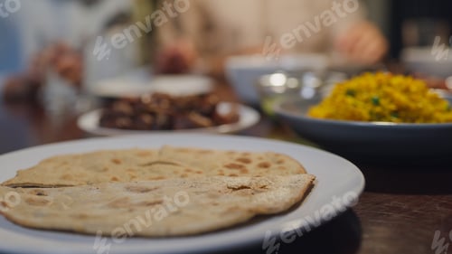 Preview: Close-up bread dish Islam woman grab naan bread for break feast.