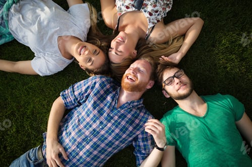 Preview: Group of people lying on grass
