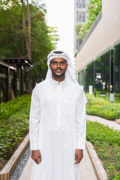 Preview: Portrait of African Muslim man wearing religious clothing an scarf outdoors