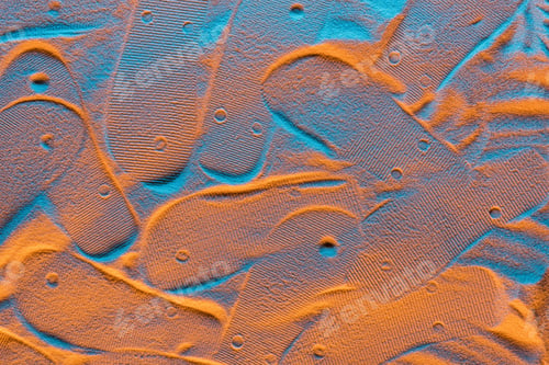 Preview: top view of textured flip flops marks on sand with color filter