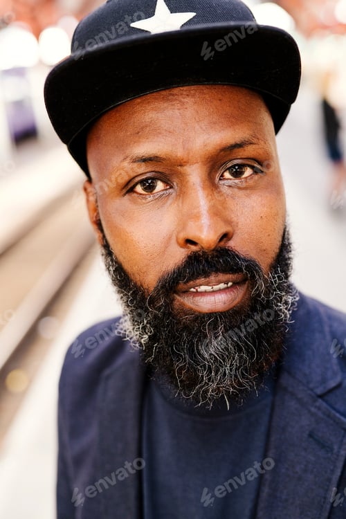 Preview: Portrait of confident businessman at railroad station