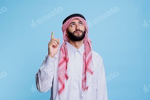 Preview: Muslim man pointing upwards with finger