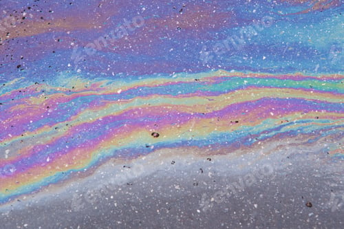 Preview: Gasoline spilled on the pavement. Space background picture. Mood.