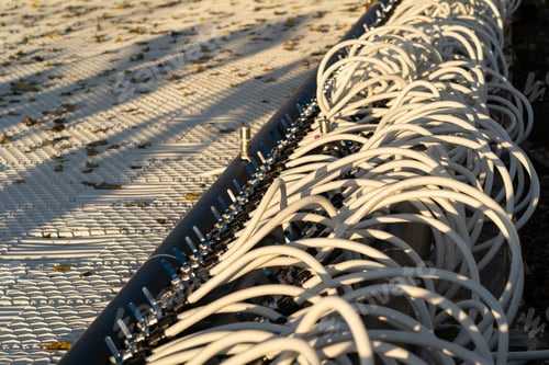 Preview: Preparing ice skating rink for outdoor activities: pipelines for filling arena with water from hose