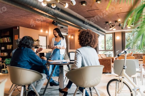 Preview: Italy, Business people having meeting in creative studio