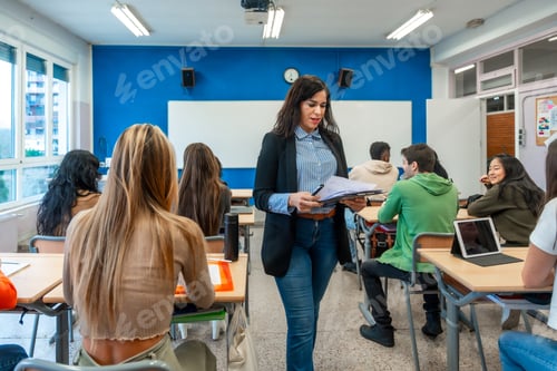 Preview: Teacher walking through classroom during lesson at university or institute