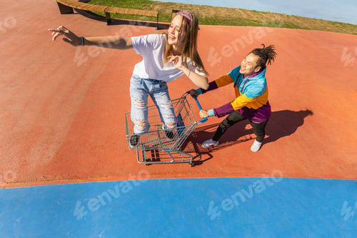 Preview: Multiracial group of young friends bonding outdoors