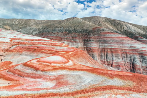 Preview: Striking geological formations with red and white layering