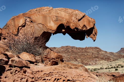 Preview: Remains of a Natural Arch near Twyfelfontain in Damaraland in Namibia
