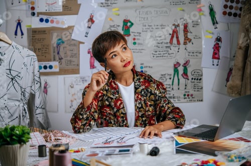 Preview: Young designer female thoughtful about her clothes design