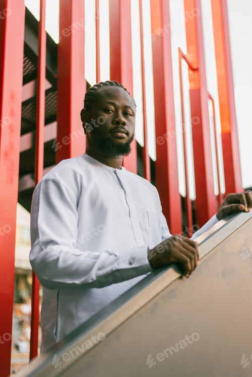 Preview: Cheerful male tourist portrait dress in white wear dashiki ethnic smiling at city street or small