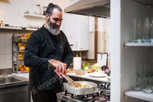 Preview: Chef working in kitchen