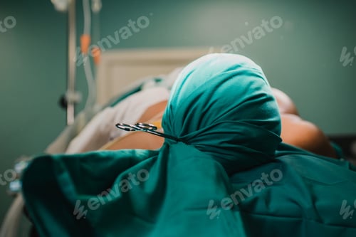 Preview: Patient sedated during the operation in a private hospital - Focus on head