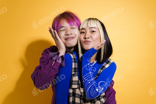 Preview: Asian couple with multicolored hair smiling and gesturing together
