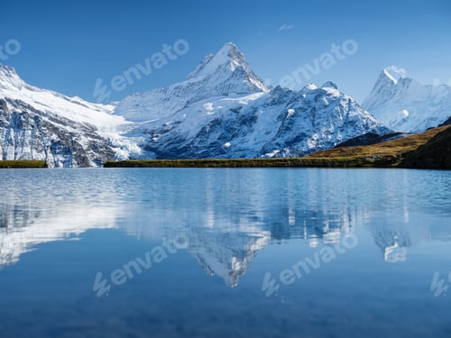 Preview: High mountains and reflection on the surface of the lake. Mountain valley with lake.