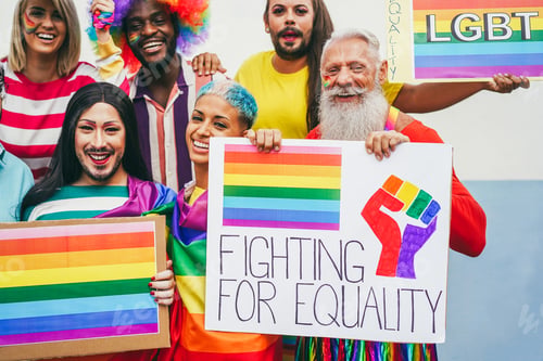 Preview: Gay people having fun at pride parade with LGBT flags outdoors - Focus on lesbian face