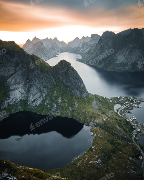 Preview: Vertical shot of a lake surrounded by rocky hills during the sunset in Austria