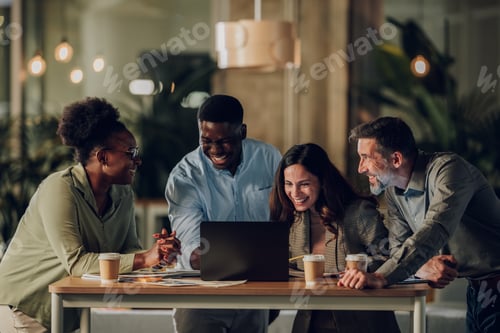 Preview: Diverse startup team collaborating and laughing together