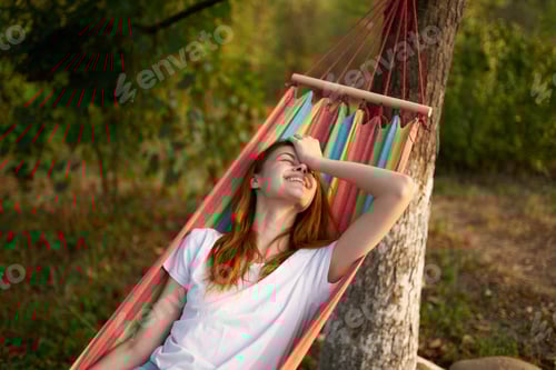 Preview: Woman Relaxing in Hammock in Nature