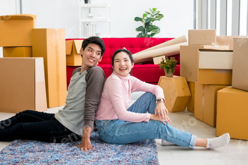 Preview: Happy young couple moving to new house together.