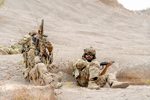 Preview: Two of military or soldiers with hold the gun stay low with lie and sit near the moutain