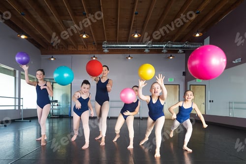Preview: Group of kids playing dodge ball in dance studio having fun